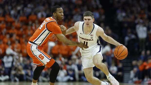 Virginia Cavaliers guard Isaac McKneely (11) drives to the basket as Syracuse Orange guard Quadir Copeland (24) defends during the second half at John Paul Jones Arena.